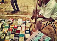 Man at the Mafroosh used book market. Photo: Khalid Albaih.