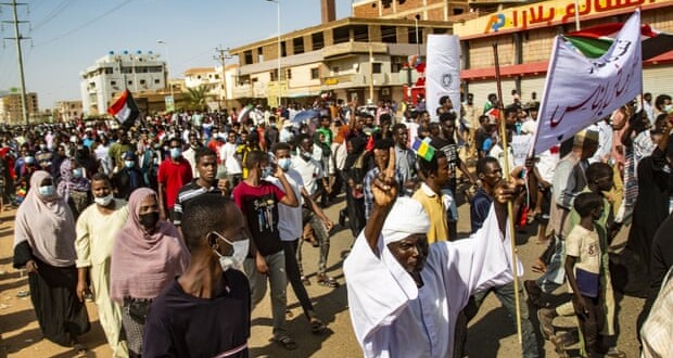 Demonstrators in Khartoum marching in support of civilian rule (Photo Credit: Anadolu Agency/Getty Images)